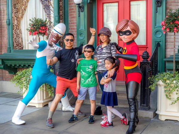 Family posing with the Incredibles at Hollywood Studios at Disney California Adventure Park