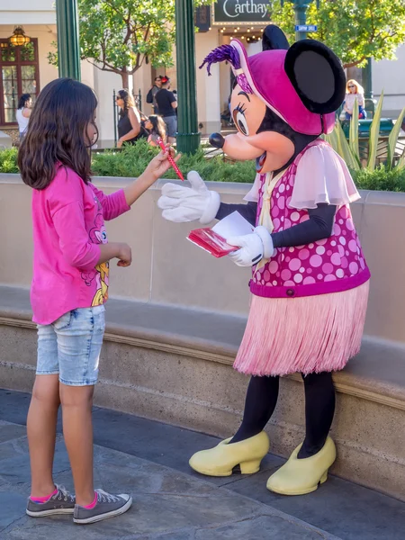 Girl meeting Minnie Mouse at Disney California Adventure Park