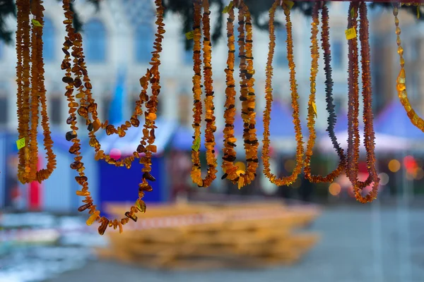 Amber beads on the Christmas Fair at New Year