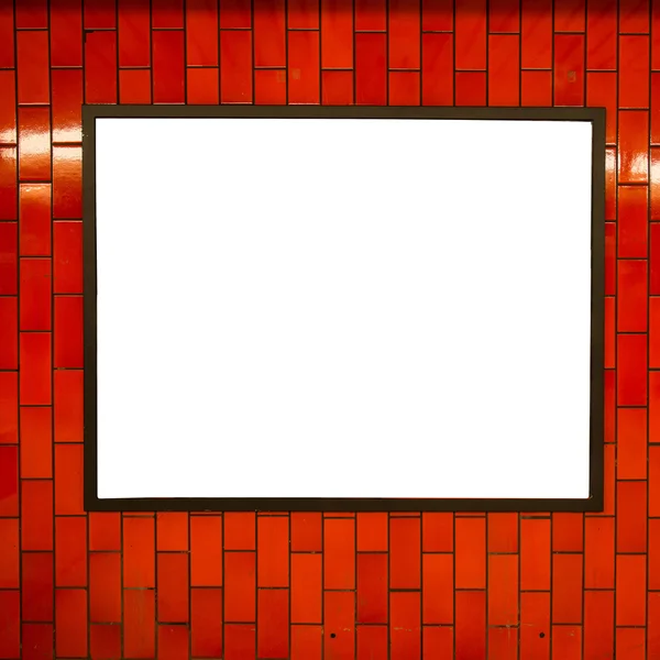 Empty billboard frame on the red brick wall