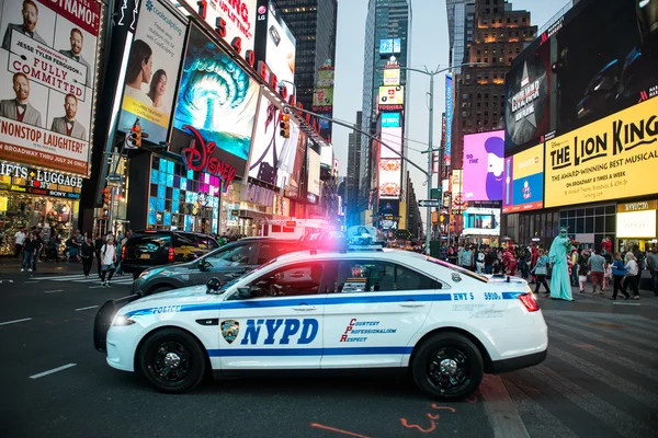NEW YORK CITY, MAY 12: NYPD police squad car goes to emergency call with alarm and siren light in the Time Square streets of New York City, New York, United States on May 12, 2016