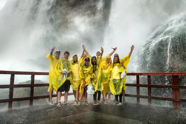 NIAGARA FALLS, NY - JULY 13: Happy Visitors on Niagara Falls on July 13, 2015 in Niagara Falls