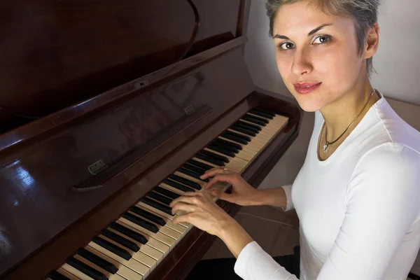Woman playing on piano