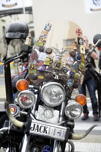 A motorcycle covered with travel memories