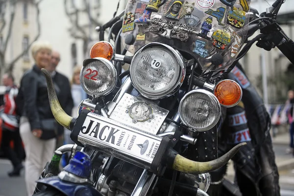 A motorcycle covered with travel memories