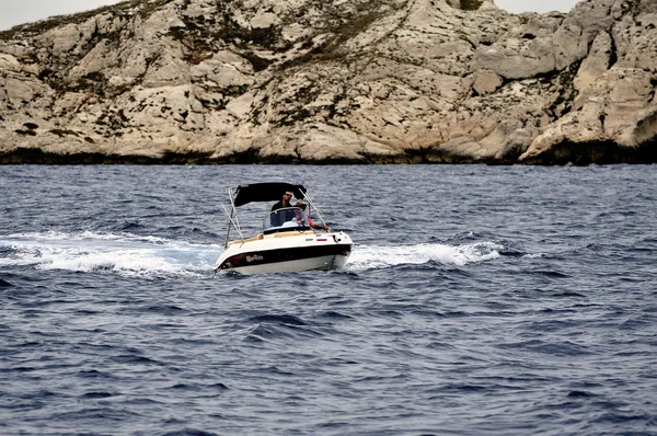 A man at full speed on a small boat