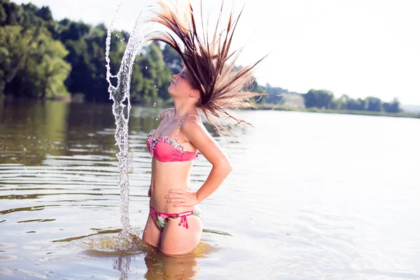 Bikini woman having fun in the water