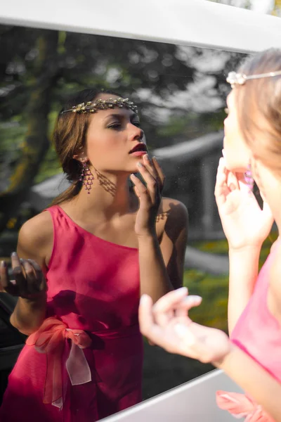 Woman looking in mirror