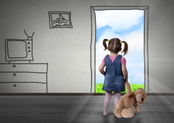 Child girl in front of the drawn door, back view. Way out concep