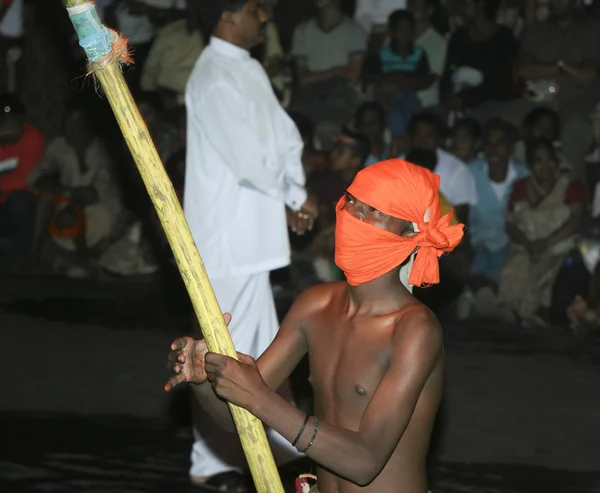 Men with torches participate the festival Pera Hera