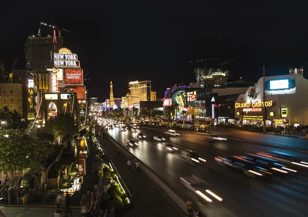 View to the Strip in Las Vegas by night with cars on the street