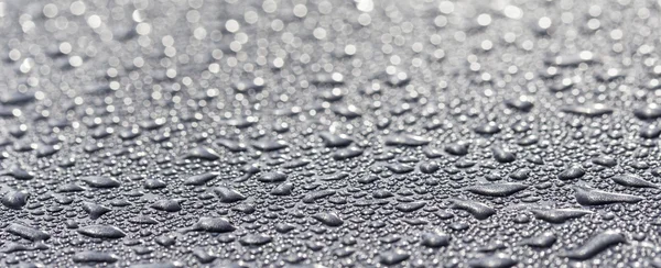 Water drops on a metallic surface