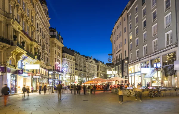 People visit Graben street in Vienna by night