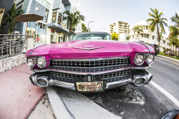 Cadillac Vintage car parked at Ocean Drive in Miami Beach