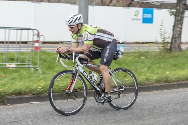 An athlete cycles in the Cologne Triathlon