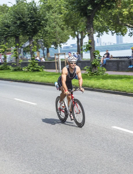 An athlete cycles in the Cologne Triathlon