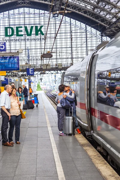 People hurry to the intercity train