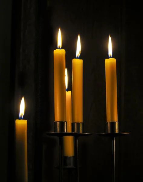 Candles burning in a  room