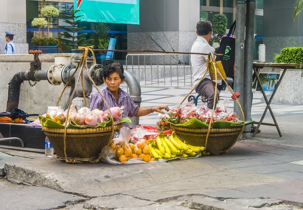 Unidentified street vendor selling vegetables in Bangkok