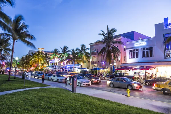 People enjoy Night view at Ocean drive  in Miami