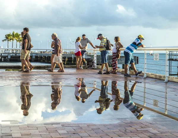 People enjoy the sunset point at Mallory square in Key Wes