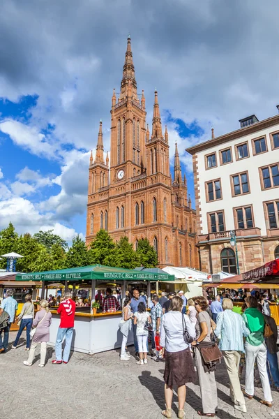 People enjoy the market at central market place in Wiesbaden