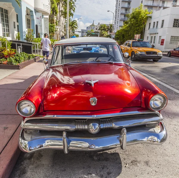 The Art Deco district in Miami and a classic oldsmobile car