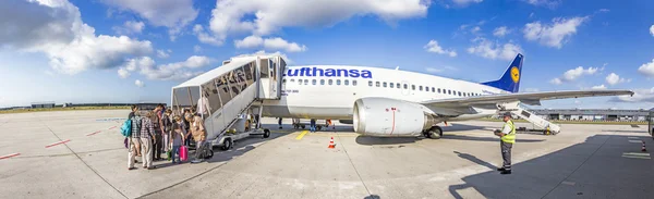 Boarding Lufthansa Jet airplane in Frankfurt airport