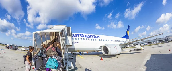 Boarding Lufthansa Jet airplane in Frankfurt airport