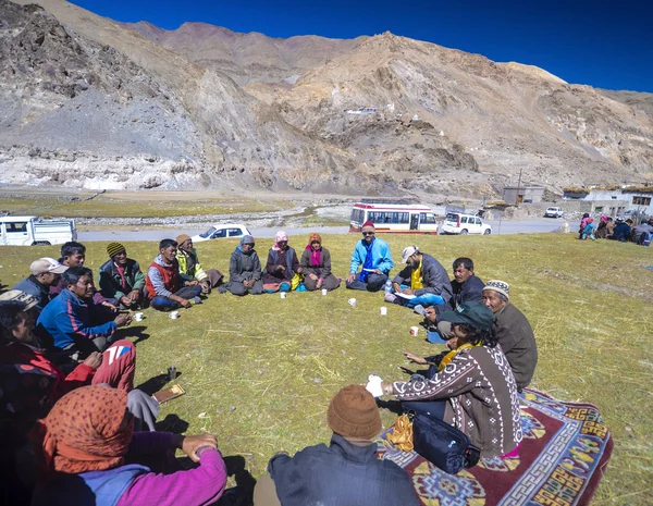 Tribal people in the mountains discuss a village issue