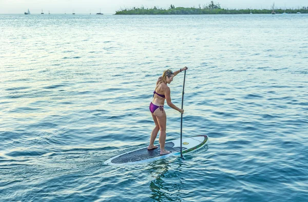 Woman enjoys Stand Up Paddle Surfing in Key West