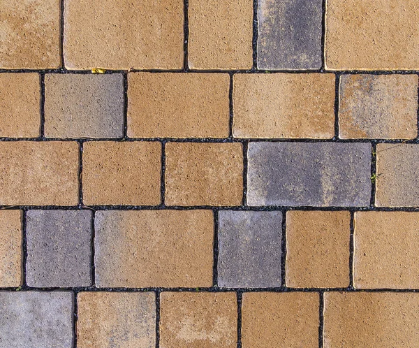 Paving blocks made of square stone in bright ligh
