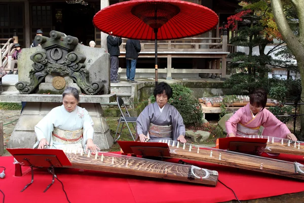 Japanese women playing the traditional instrument