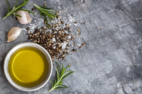 Food Background Olive Oil Salt Peppercorns Rosemary and Garlic o