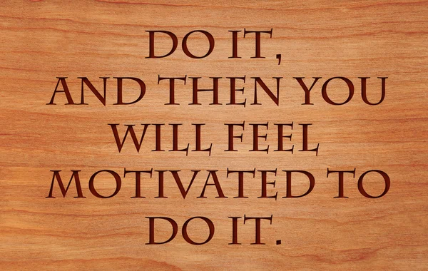 Do it, and then you will feel motivated to do it - motivational quote on wooden red oak background
