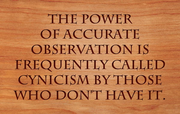 The power of accurate observation is frequently called cynicism by those who don\'t have it  - quote on wooden red oak background