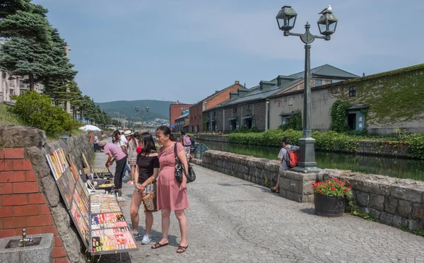 Tourists sightseeing in the street of Otaru City, Japan