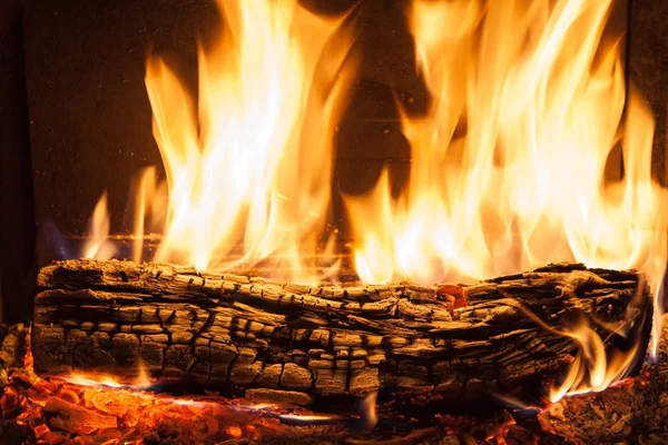 Burning billets in fireplace