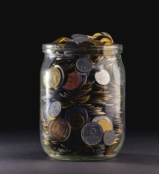 Jar of Money Isolated on a black Background