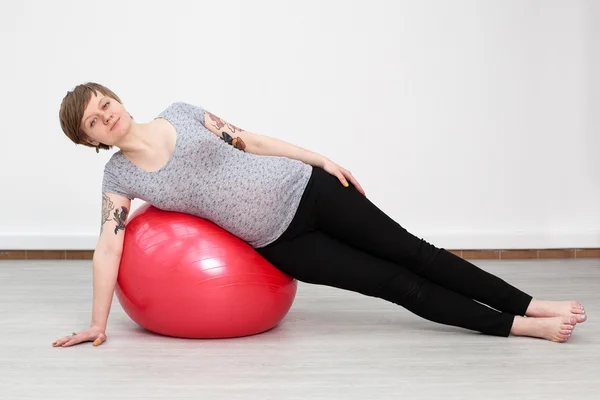 Pregnant woman doing a side plank