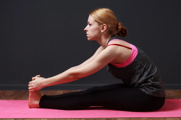 Yoga.Young blonde woman doing yoga exercise