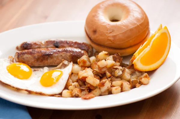 Delicious breakfast sausage with sunny side up eggs