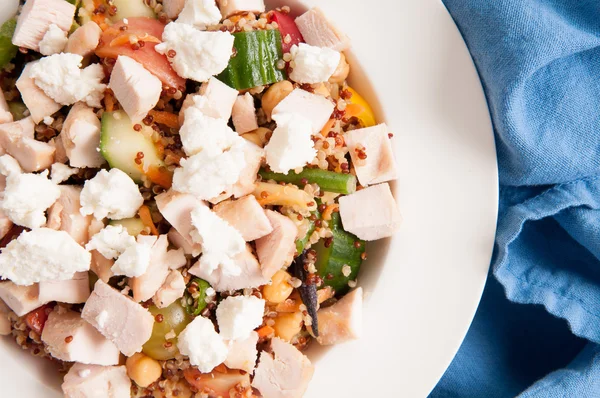 Chickpea and quinoa salad with diced chicken and goat cheese