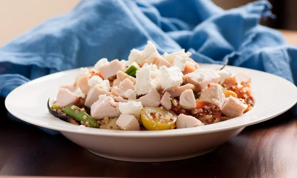 Chickpea and quinoa salad with diced chicken and goat cheese