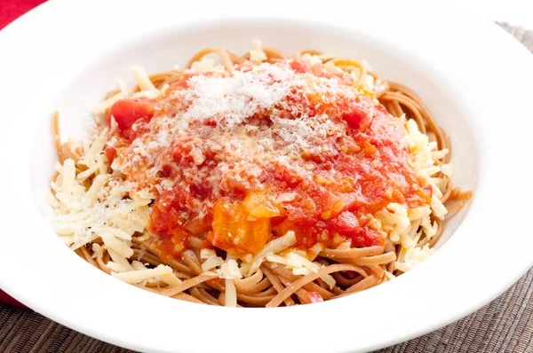 Tomato sauce on whole wheat pasta with cheese