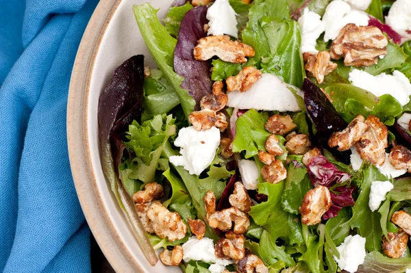 Tossed garden salad with walnuts