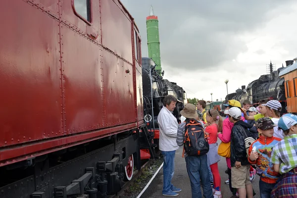 ST. PETERSBURG, RUSSIA - JULY 23, 2015: The school excursion group listens to the guide on the platform