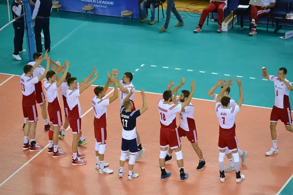 KALININGRAD, RUSSIA - JUNE 18, 2016: Players of a national team of Poland on volleyball welcome each other before a match. The XXVII tournament of World league on volleyball of 2016 among men\'s teams