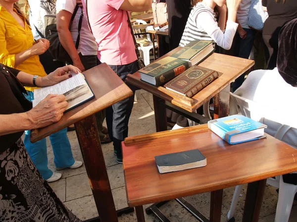 JERUSALEM, ISRAEL - OCTOBER 09, 2012: Religious Judaic books lie on little tables during a prayer