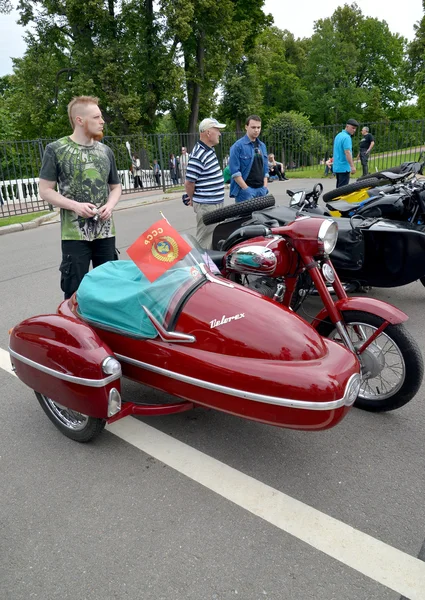 PETERHOF, RUSSIA - JULY 26, 2015: The old Czechoslovak Java motorcycle (Jawa) with the side trailer costs at a street exhibition